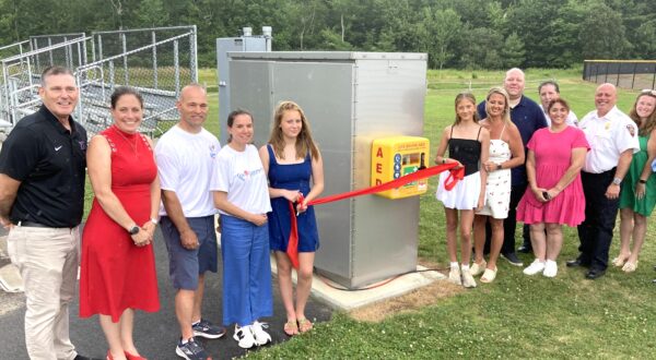 A new outdoor automated external defibrillators (AED) unit was unveiled during a ribbon cutting ceremony at Norton Veterans Memorial Field on Monday, July 7. A total of eight AEDs have been installed throughout the Town of Norton thanks to a donation from Sisters@Heart.